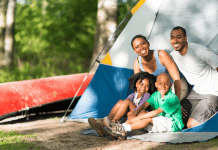 Camping With Young Children and Actually Enjoying It family camping- looking out from the doorway of their tent