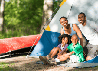 Camping With Young Children and Actually Enjoying It family camping- looking out from the doorway of their tent