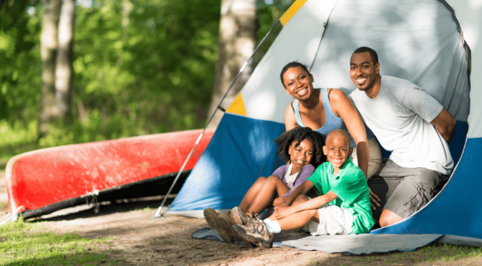 Camping With Young Children and Actually Enjoying It family camping- looking out from the doorway of their tent
