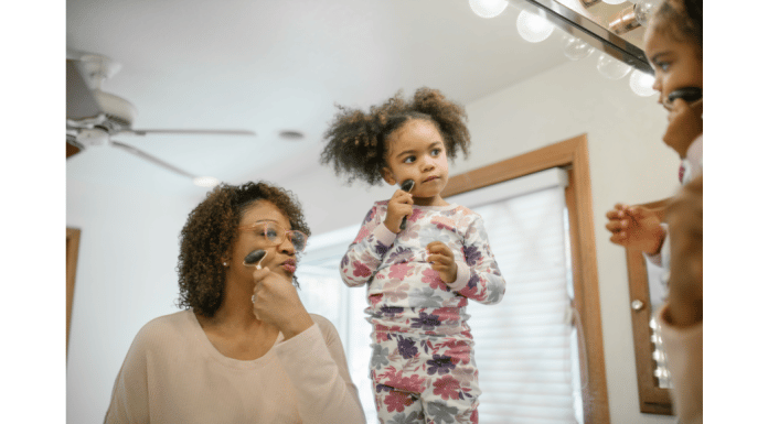 mother and daughter using Gua Sha stone