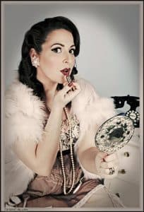 Woman in retro look wearing red lipstick