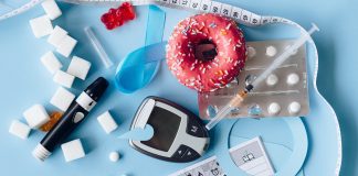 What I Wish I Knew About Living with Gestational Diabetes A wide array of diabetes-related paraphernalia. A black finger stick and reader. An empty syringe. Sugar cubes and a pink frosted donut.