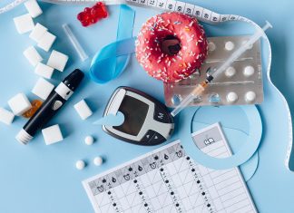 What I Wish I Knew About Living with Gestational Diabetes A wide array of diabetes-related paraphernalia. A black finger stick and reader. An empty syringe. Sugar cubes and a pink frosted donut.
