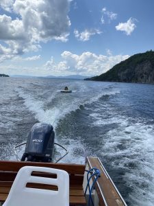 Motor boat pulling someone on a tube in the water