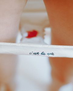 Red spots in white underwear. The underwear reads “c’est la vie”