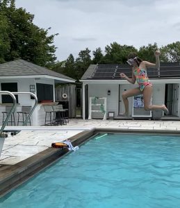 child jumping into a pool at Basin Harbor