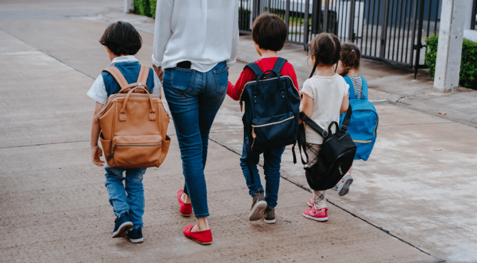The Impossible Task of Treating Your Kids Equally little kids and mom walking