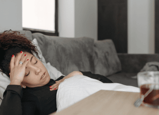 Make Your Own College Medical Kit from a College Health Physician student with a cold and headache, resting