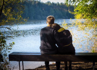 Weekend Afternoon Date Ideas in Chittenden County Couple looking out at a lake together.