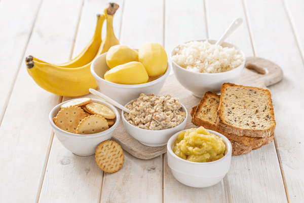 Food display with bananas, crackers, and bread.
