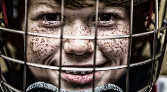 Concussions in Kids- Signs and Symptoms child wearing a helmet