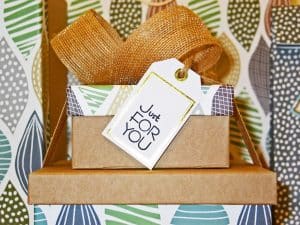 Wrapped gifts with tag that writes "Just For You"