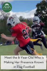 Girl in a red jersey playing flag football