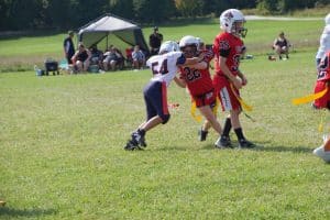 Young girl playing flag football