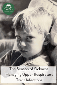 sick boy stares at the camera miserably