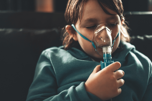 sick child receiving treatment for an upper respiratory tract infection