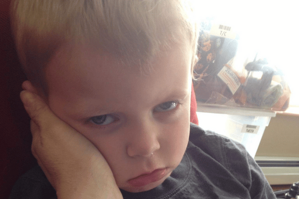 Sad boy sick with an upper respiratory tract infection
