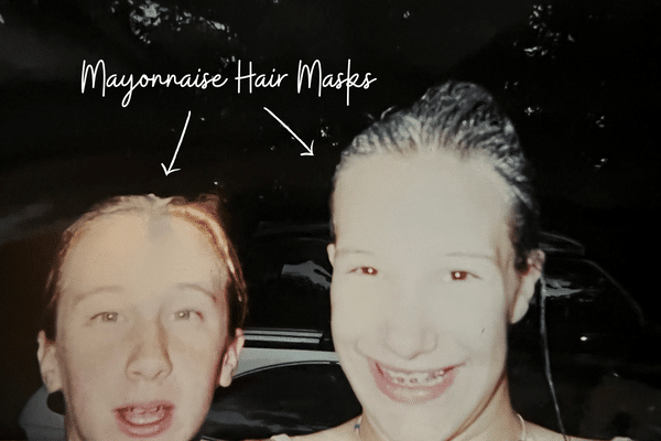 Two young girls with mayonnaise hair masks.