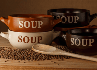 Easy Soup Recipes When You’re Low on Groceries four soup crocks with the work SOUP written on the outside of them next to a wooden spoon