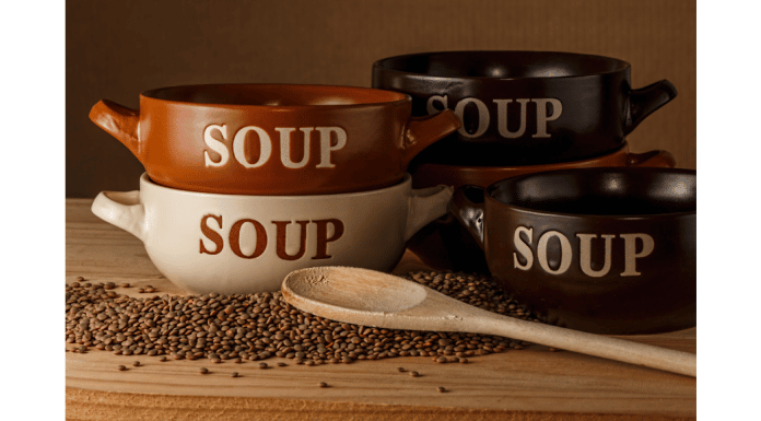 Easy Soup Recipes When You’re Low on Groceries four soup crocks with the work SOUP written on the outside of them next to a wooden spoon