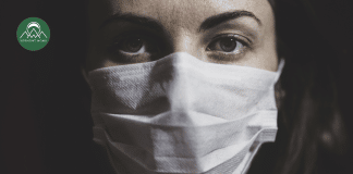 The Gray Zone of Chronic Illness woman with a mask