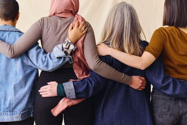 mom life after 40: women with arms around each other