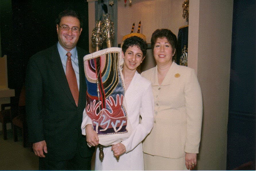 me and family with torah Davida at her Bat-mitzvah when she was 12 years old. She almost has a buzz cut. She was bullied because of this haircut.