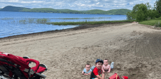 Ultimate Summer Fun for Kids in Milton, Vermont Kids sitting at the beach.