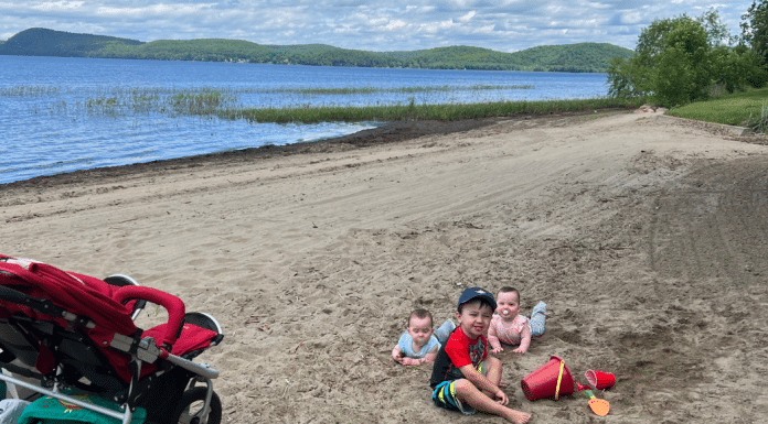 Ultimate Summer Fun for Kids in Milton, Vermont Kids sitting at the beach.
