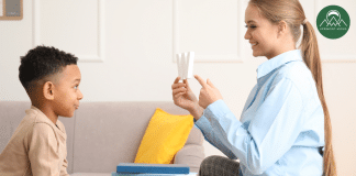 Childhood Speech Disfluencies: Is My Child Stuttering? A young boy and his language teacher