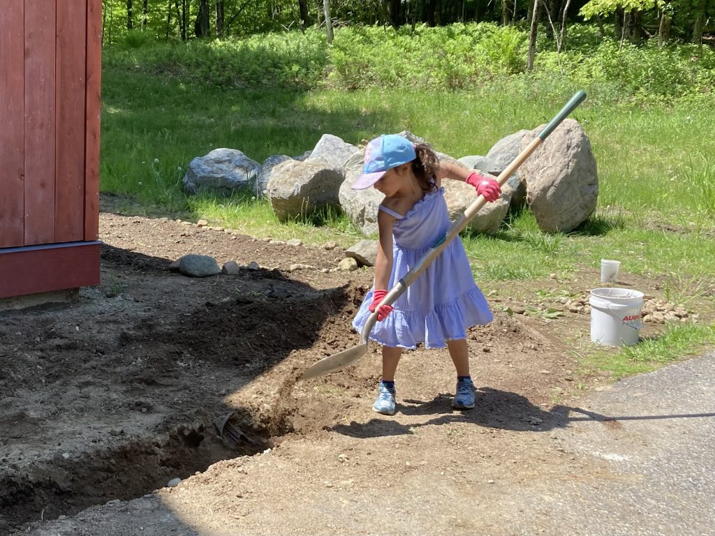 child working in the garden