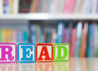 12 Summer Children’s Books to Enjoy with Your Family blocks spell out the word read in front of book shelves