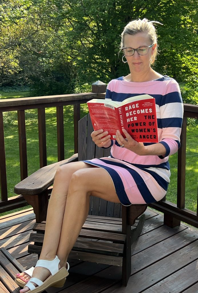 Woman reading a book about feminism