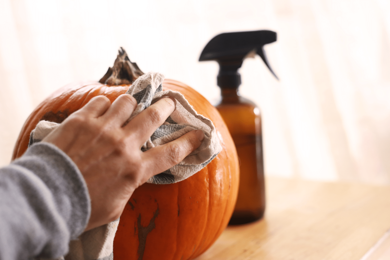 cleaning a pumpkin to prepare it for the craft