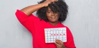 Is It Menopause or Am I Pregnant?: A 45 Year-Old Mom Learns To Love Menstruation a woman with a calendar in her hands is it menopause
