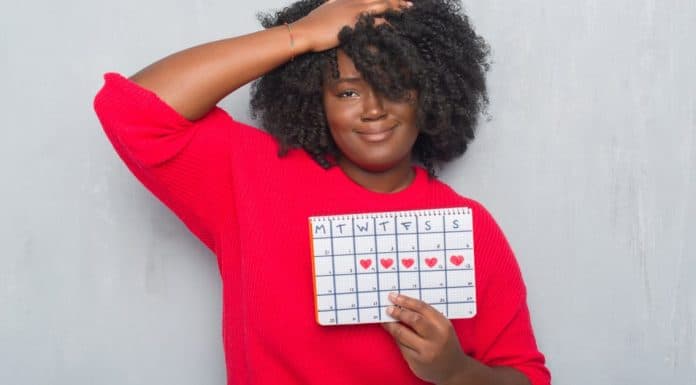 Is It Menopause or Am I Pregnant?: A 45 Year-Old Mom Learns To Love Menstruation a woman with a calendar in her hands is it menopause