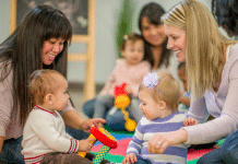 Where to Find Indoor Toddler Activities Within 30 Minutes of Burlington Two moms playing with their toddlers at a play group.