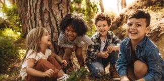 How to Play Safe: What Are the Questions to Ask Before a Drop Off Playdate? children playing outside by a tree. What are the questions to ask before a drop off playdate?