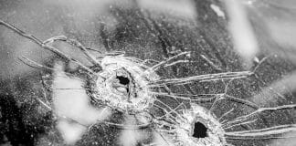 bullet holes in glass