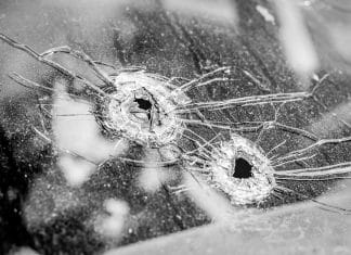 bullet holes in glass