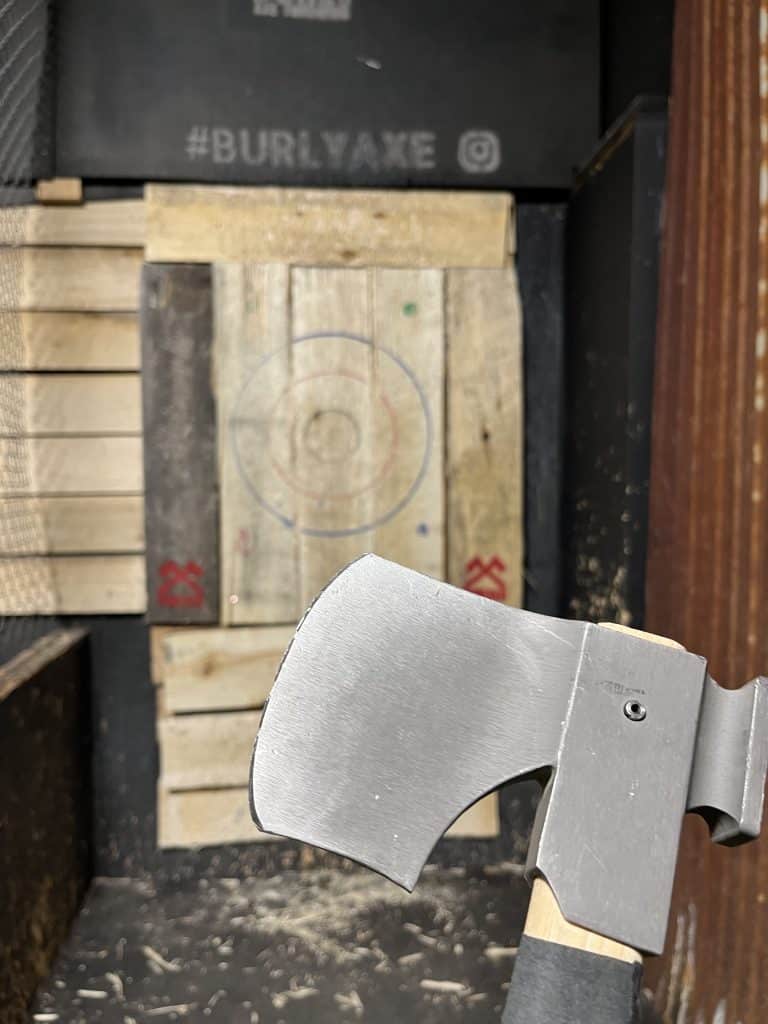 throwing axe embedded in wood