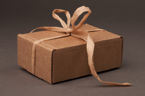 PLain wrapped mom's bad day box with a raffia bow