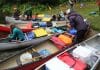 Canoes are loaded to bring campers to Water Wanderings wilderness camp rustic camp site