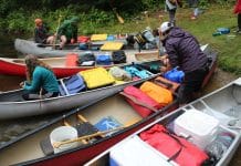 Water Wanderings Wilderness Camp Ignites Lifelong Learning and Leadership Canoes are loaded to bring campers to Water Wanderings wilderness camp rustic camp site