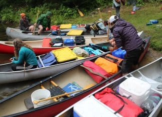 Water Wanderings Wilderness Camp Ignites Lifelong Learning and Leadership Canoes are loaded to bring campers to Water Wanderings wilderness camp rustic camp site