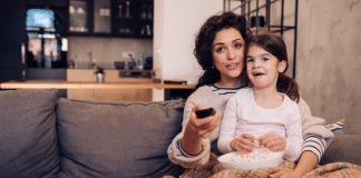 Momspiration Moment: Why Chilli from Bluey Inspires Me Little girl watching tv with mom