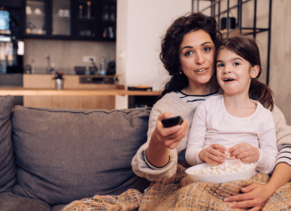 Momspiration Moment: Why Chilli from Bluey Inspires Me Little girl watching tv with mom