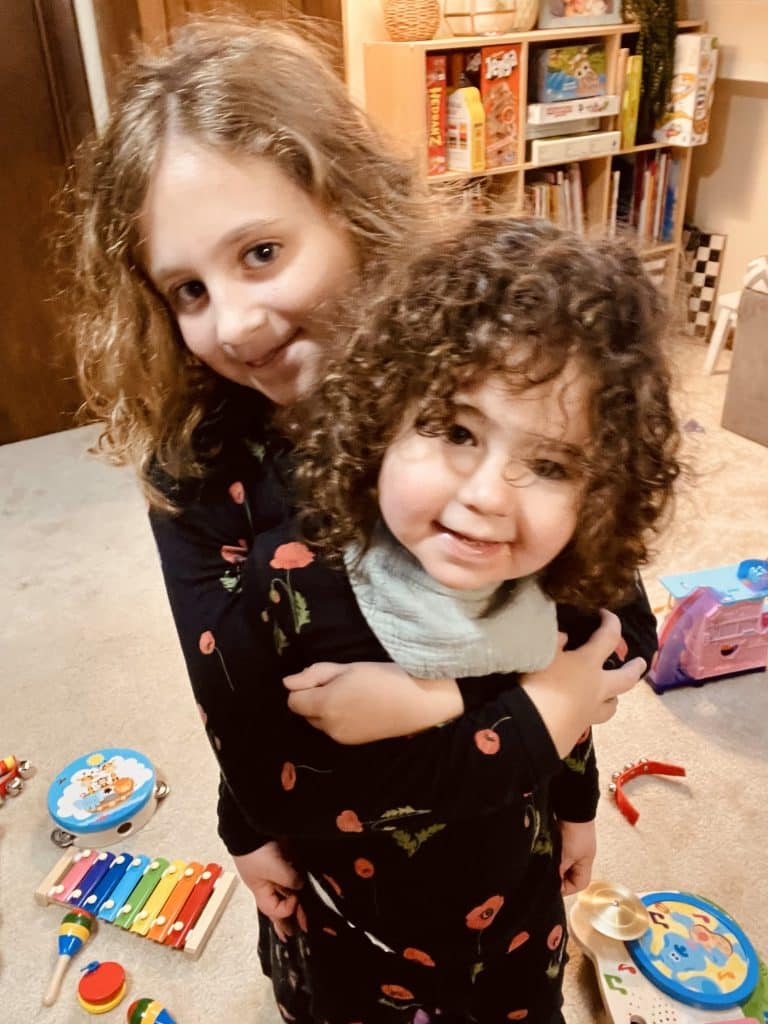 Sisters embracing