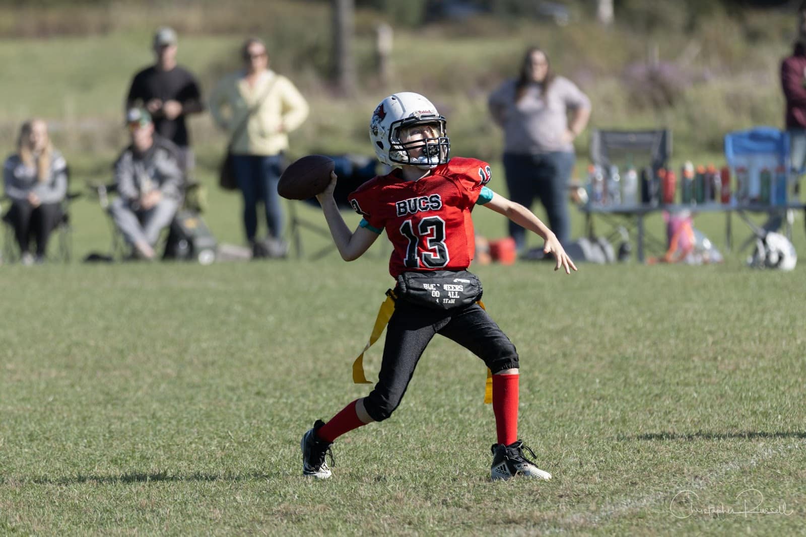 Flag football player throwing the ball.