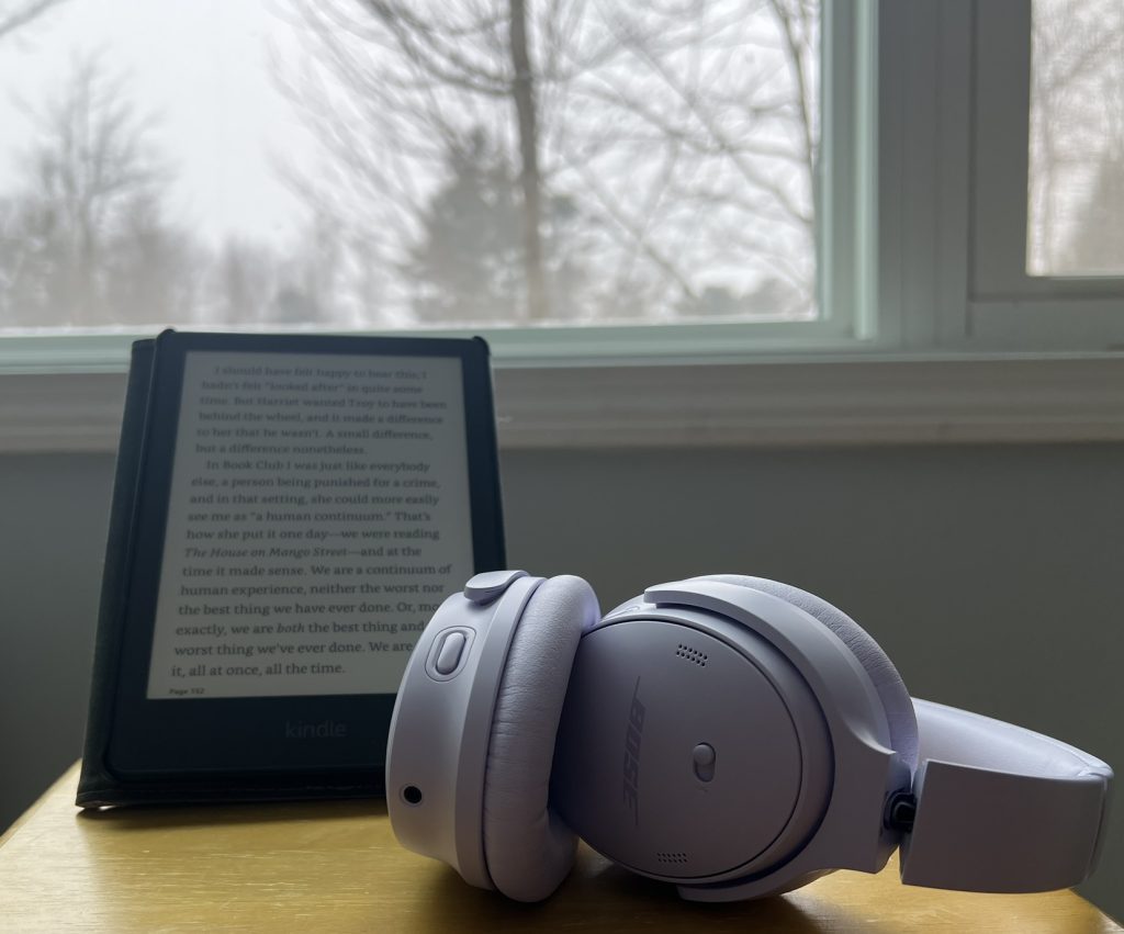 e-reader and noise cancelling headphones for better reading